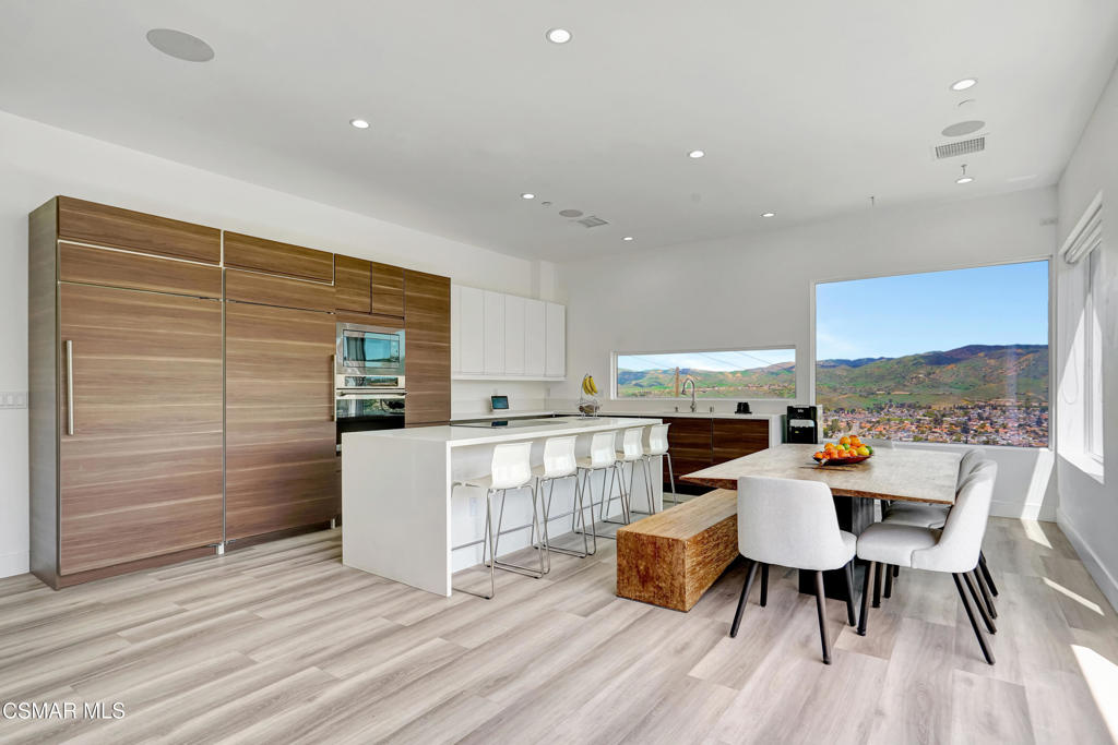 990 Alta Vista Road Simi Valley, CA 93063 - Photo 5 of 36 a dining room with furniture and wooden floor
