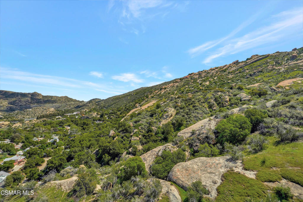 990 Alta Vista Road Simi Valley, CA 93063 - Photo 10 of 36 a view of a large building with mountains in the background