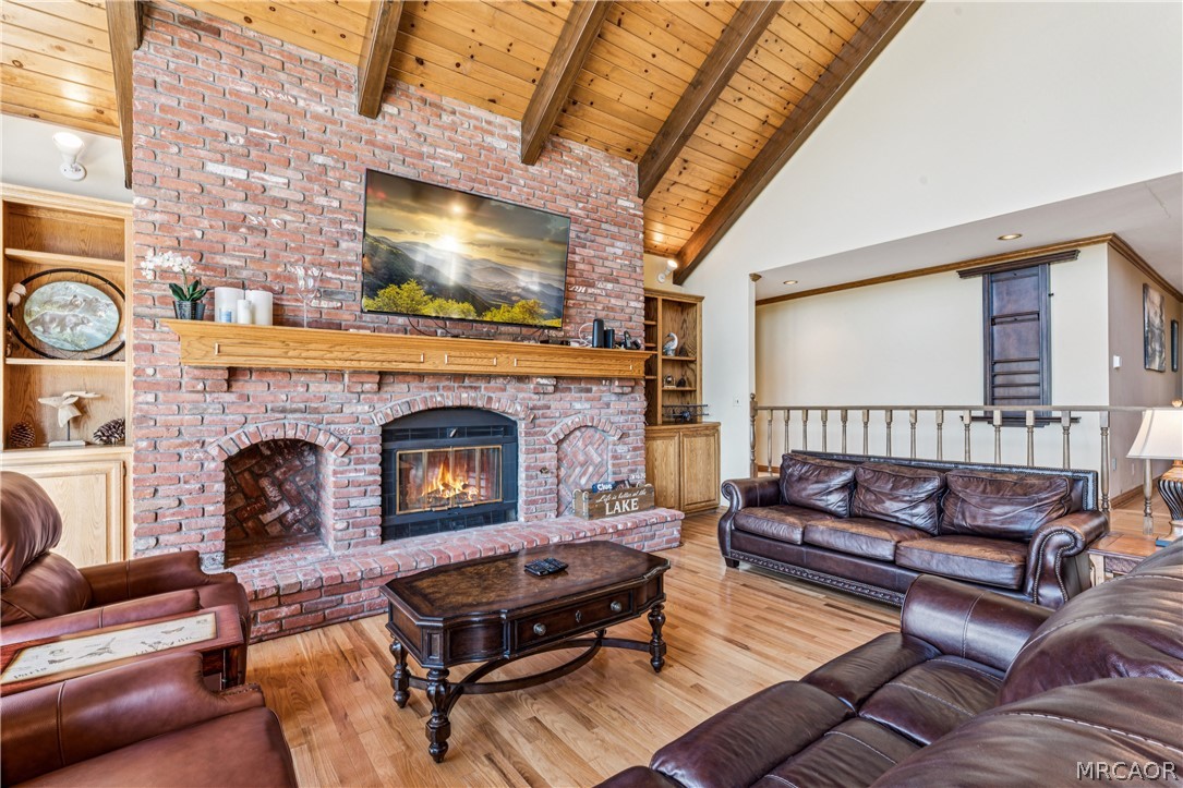28994 North Shore Road Lake Arrowhead, CA 92352 - Photo 11 of 50 a living room with furniture and a fireplace