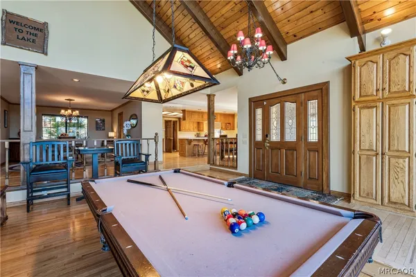 a dining room with furniture and chandelier
