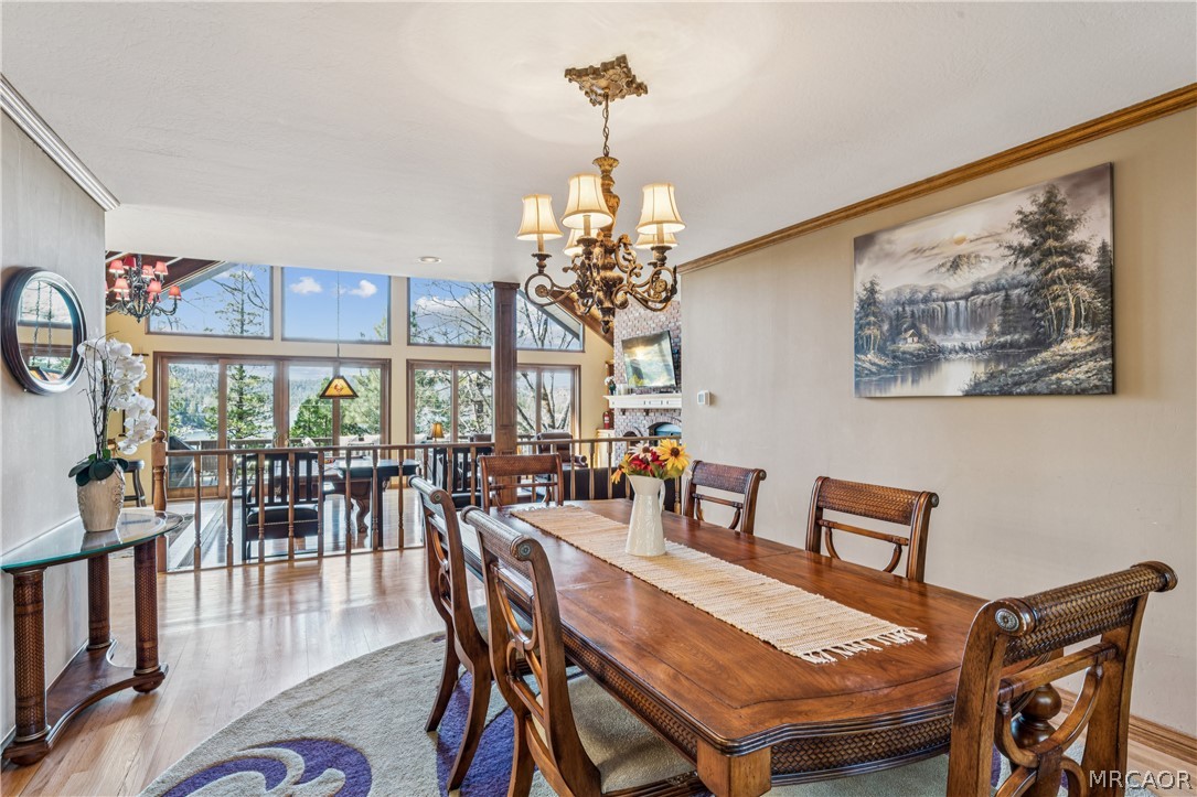 28994 North Shore Road Lake Arrowhead, CA 92352 - Photo 17 of 50 a view of a dining room with furniture window and wooden floor