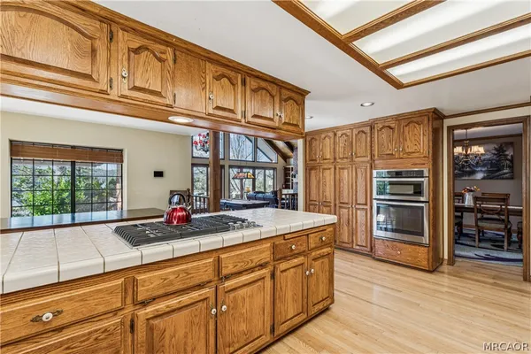 a view of a refrigerator in kitchen and wooden floor
