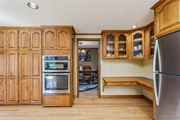 a view of a hallway with washer and dryer