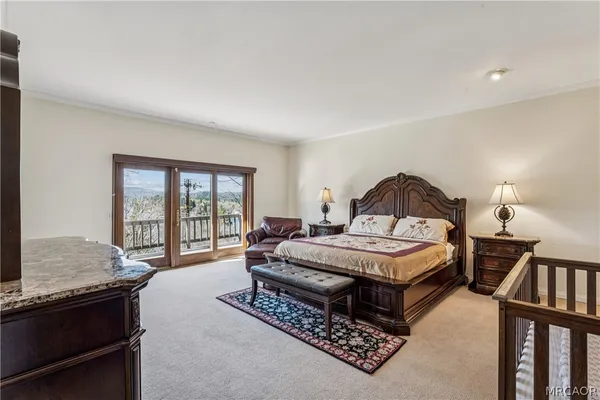 a large white tub sitting in a bathroom next to a window