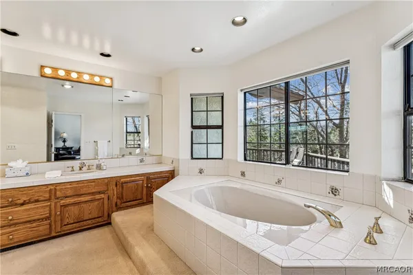 a bathroom with a sink double vanity and a mirror