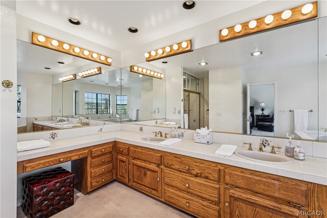 28994 North Shore Road Lake Arrowhead, CA 92352 - Photo 27 of 50 a bathroom with a sink double vanity and a mirror