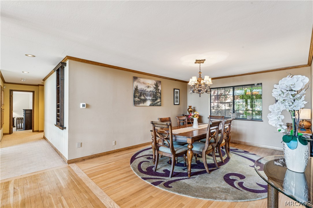 28994 North Shore Road Lake Arrowhead, CA 92352 - Photo 28 of 50 a view of a dining room with furniture window and wooden floor