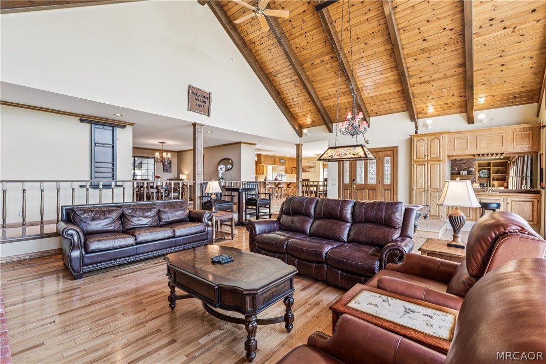 28994 North Shore Road Lake Arrowhead, CA 92352 - Photo 30 of 50 a living room with furniture a wooden floor and next to a window