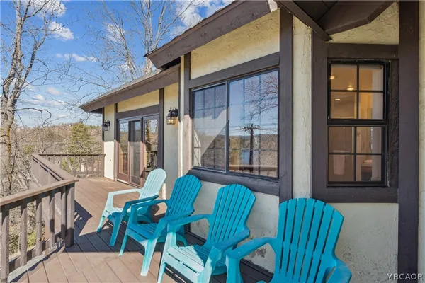 a view of house with outdoor space and sitting area