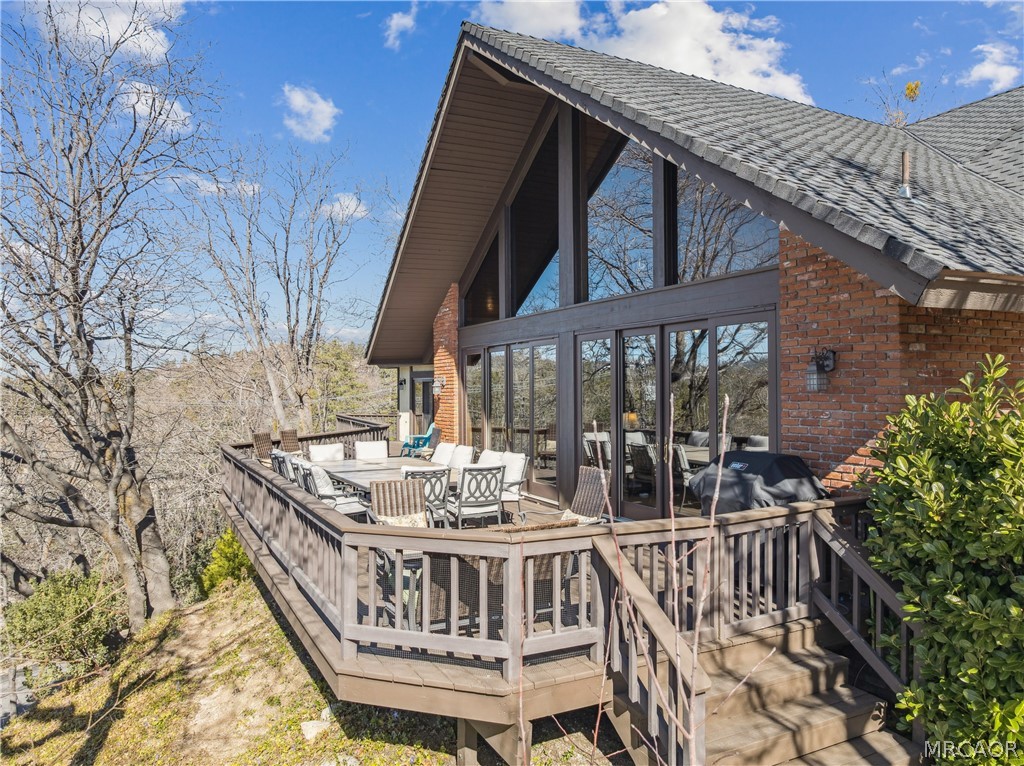 28994 North Shore Road Lake Arrowhead, CA 92352 - Photo 42 of 50 a view of balcony with wooden floor and outdoor seating