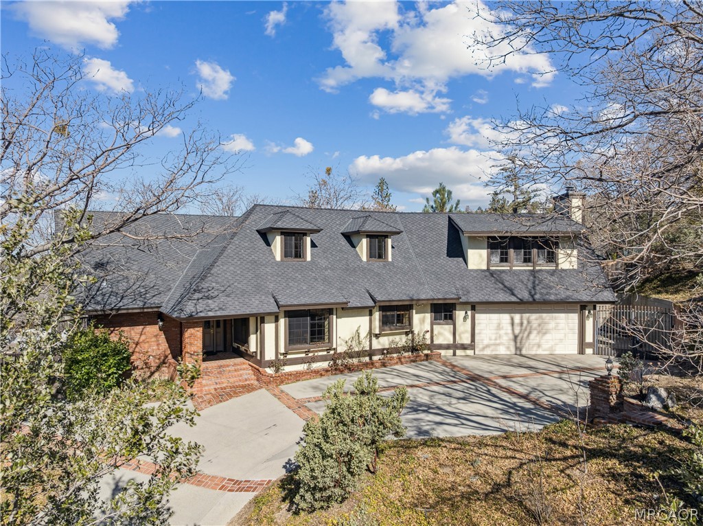 28994 North Shore Road Lake Arrowhead, CA 92352 - Photo 43 of 50 a front view of a house with a yard
