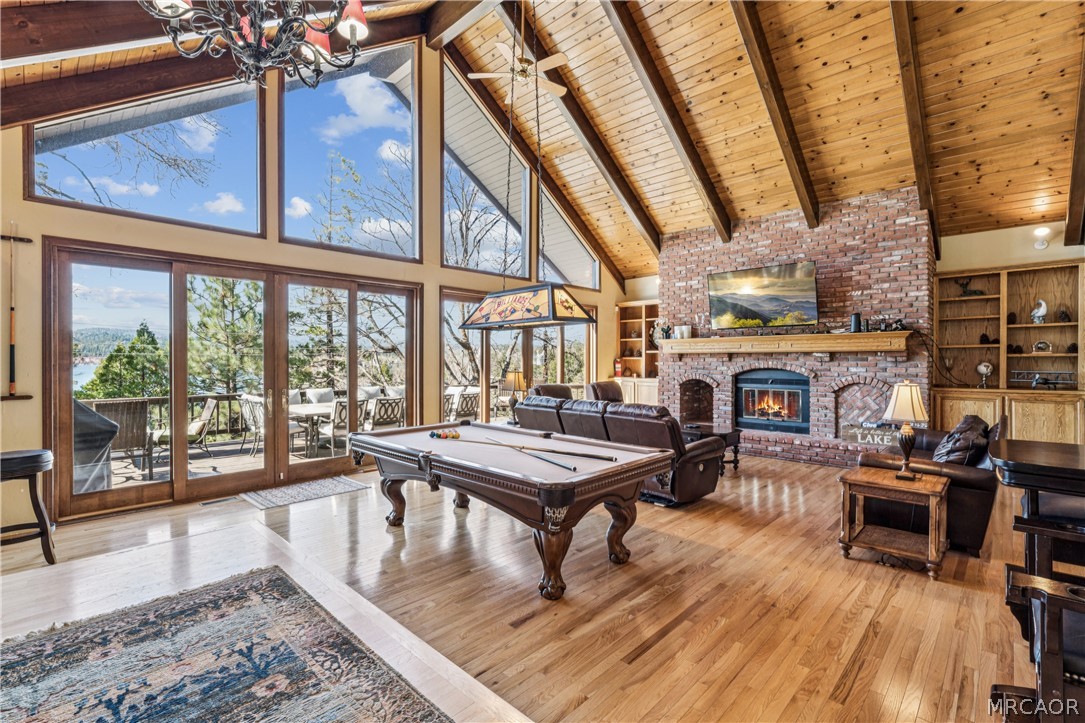 28994 North Shore Road Lake Arrowhead, CA 92352 - Photo 5 of 50 a living room with furniture a fireplace and wooden floor