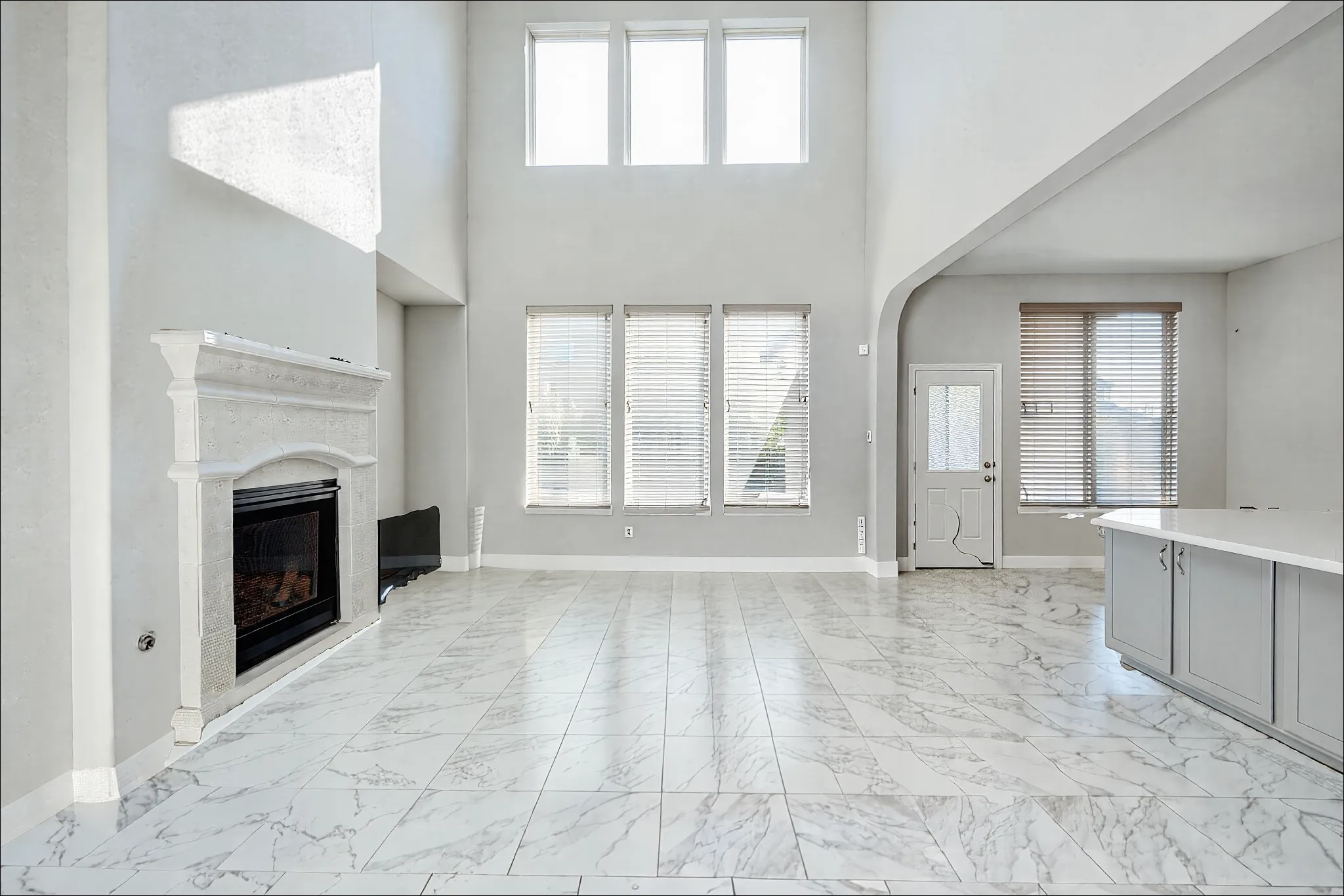 23527 San Ricci Court Richmond, TX 77406 - Photo 11 of 37 a view of an empty room with window and fire place