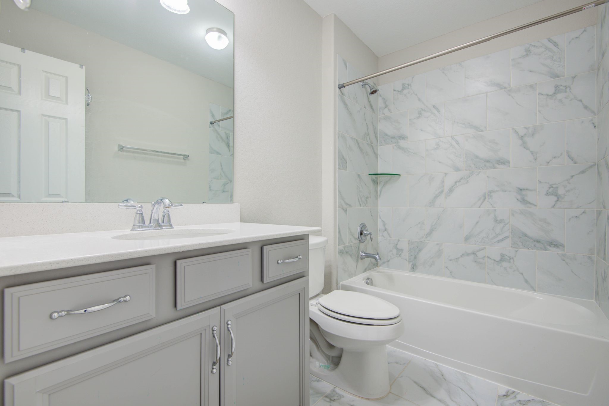 23527 San Ricci Court Richmond, TX 77406 - Photo 21 of 37 a bathroom with a sink a toilet and a bathtub