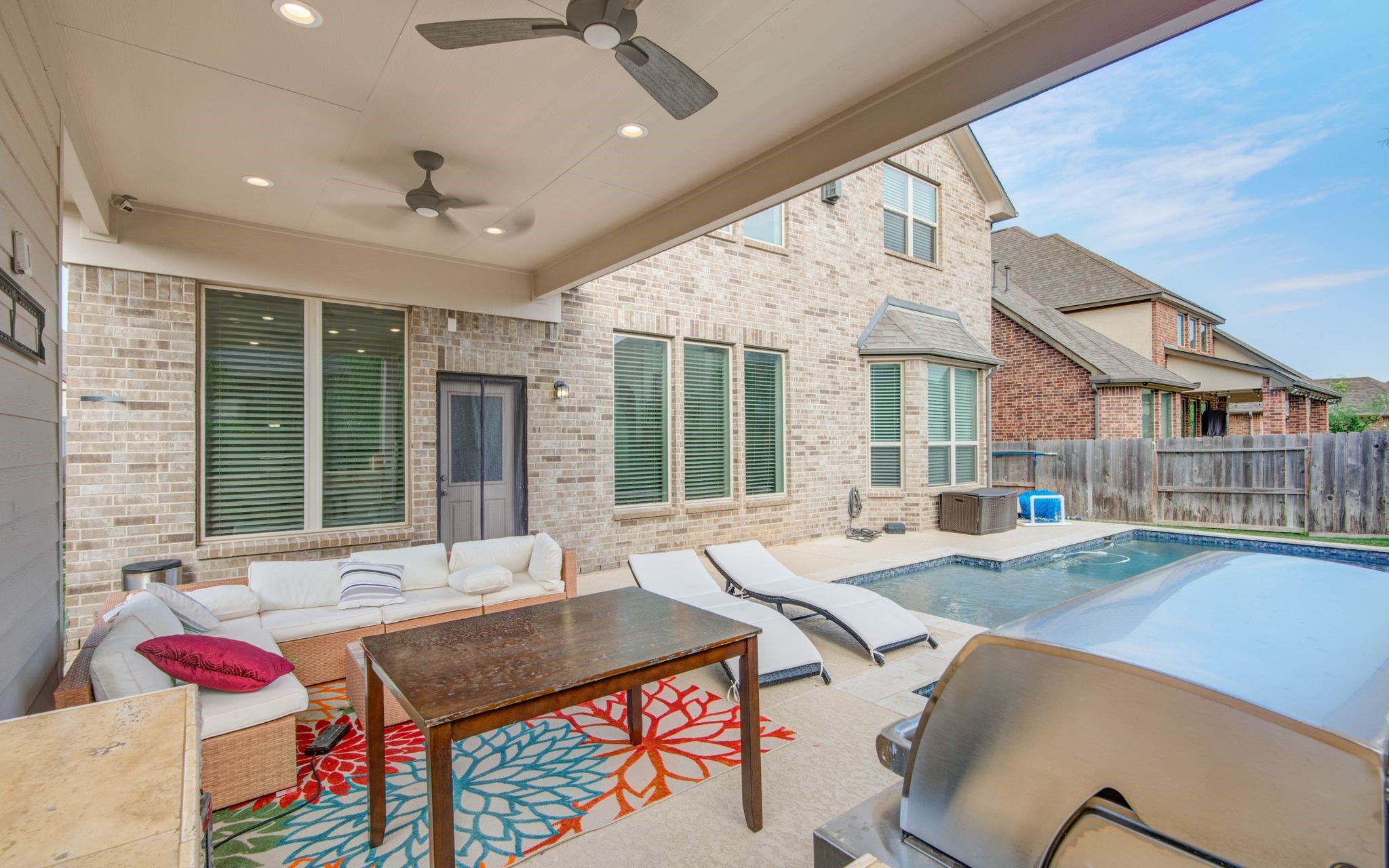 23527 San Ricci Court Richmond, TX 77406 - Photo 23 of 37 a living room with fireplace furniture and a large window