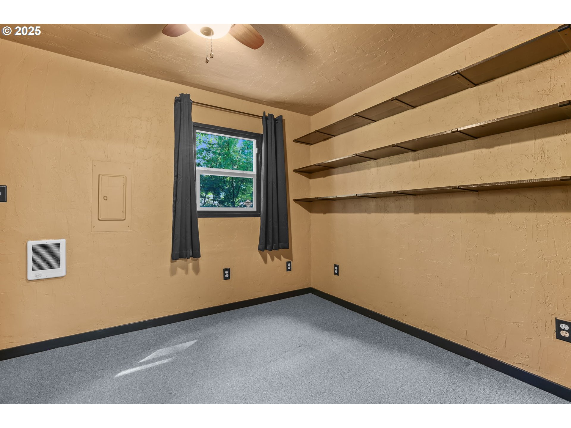 24082 East Decatur Road Welches, OR 97067 - Photo 11 of 44 a view of an empty room with wooden floor and a window