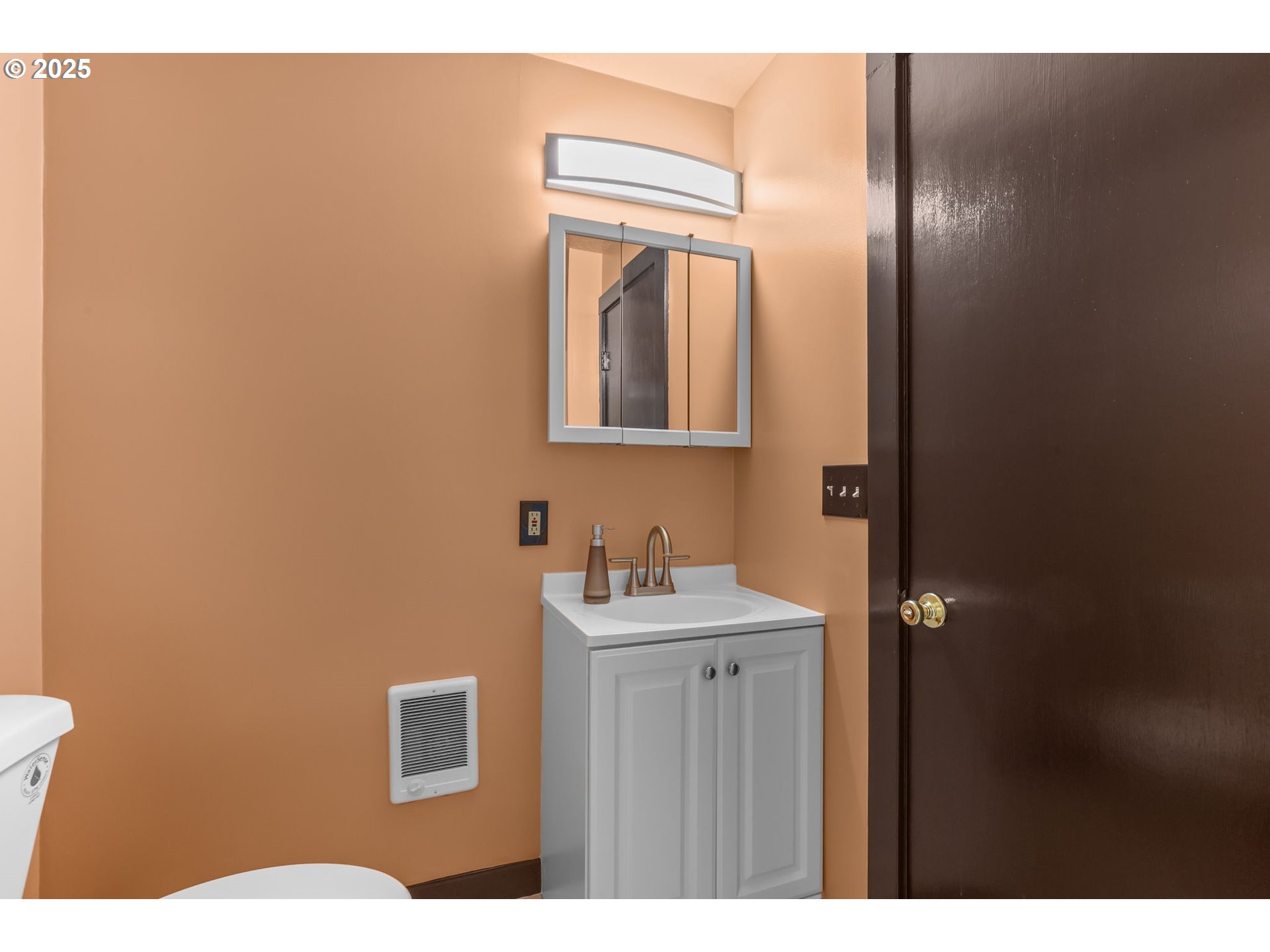 24082 East Decatur Road Welches, OR 97067 - Photo 20 of 44 a bathroom with a sink mirror toilet and vanity