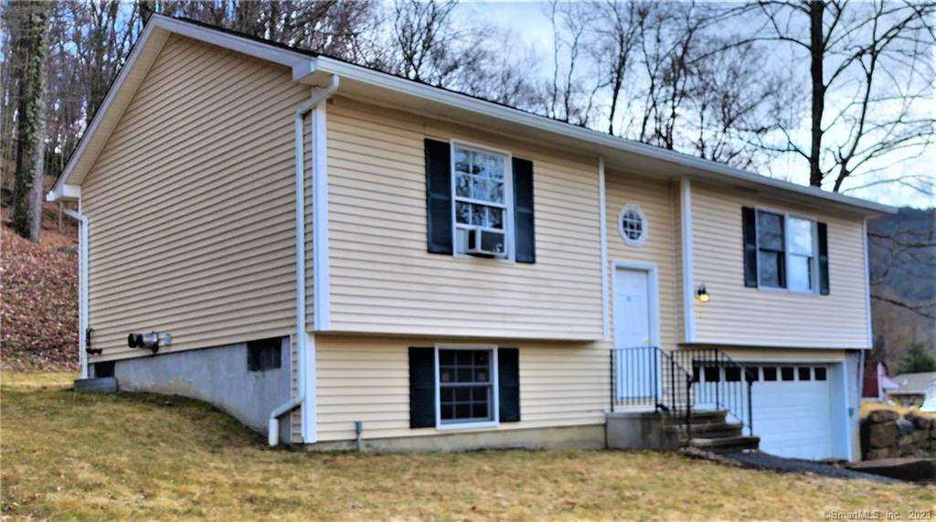 45 Maple St Extension Kent, CT 06757 - Photo 1 of 1 a view of a house with a yard and sitting area