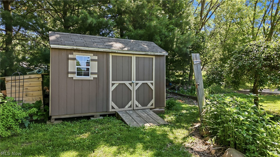 6127 Columbus Road Northeast Louisville, OH 44641 - Photo 40 of 49 Newer shed for storing your mower and gardening needs