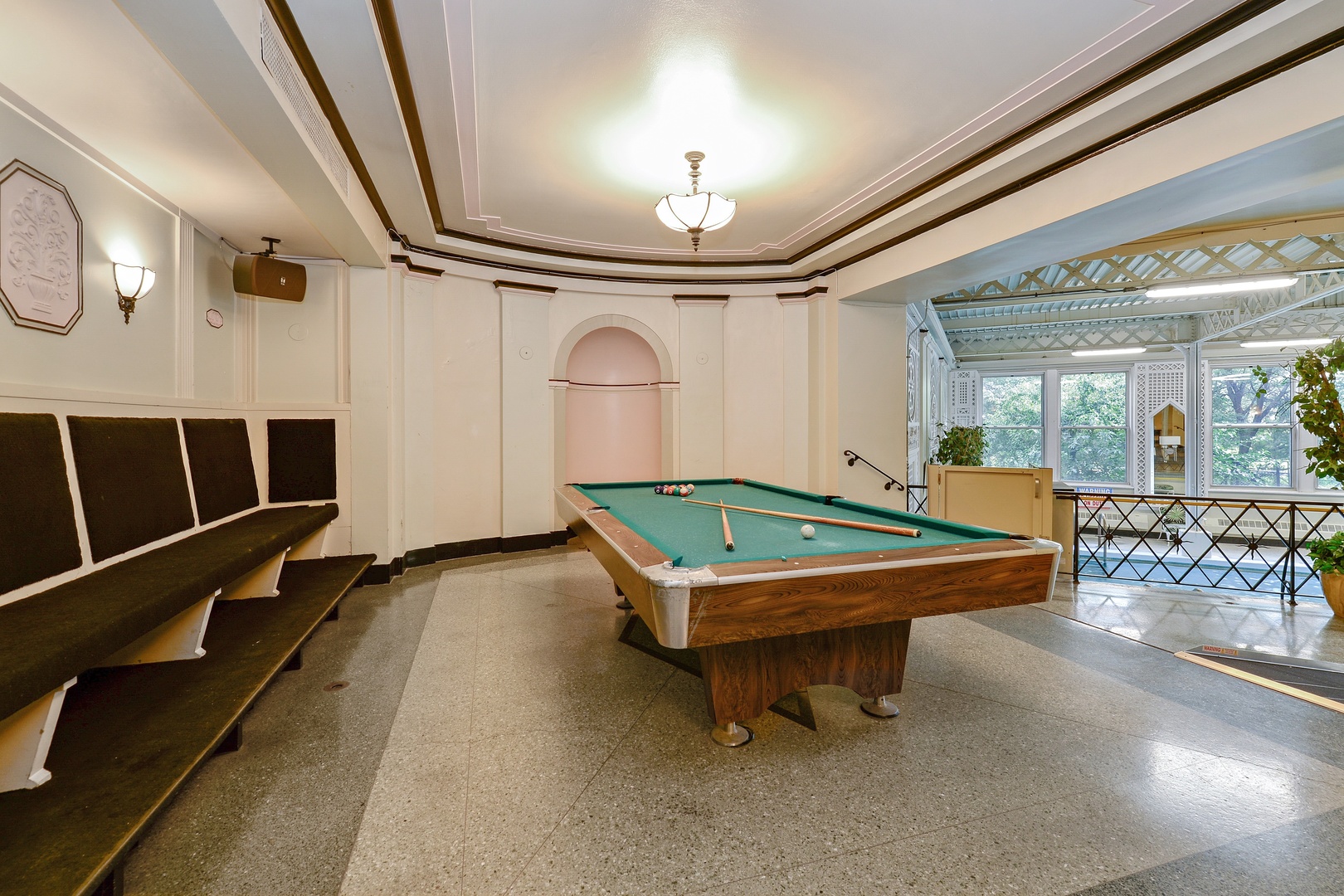 5555 North Sheridan Road, Unit 131 Chicago, IL 60640 - Photo 14 of 24 a room with furniture pool table and windows