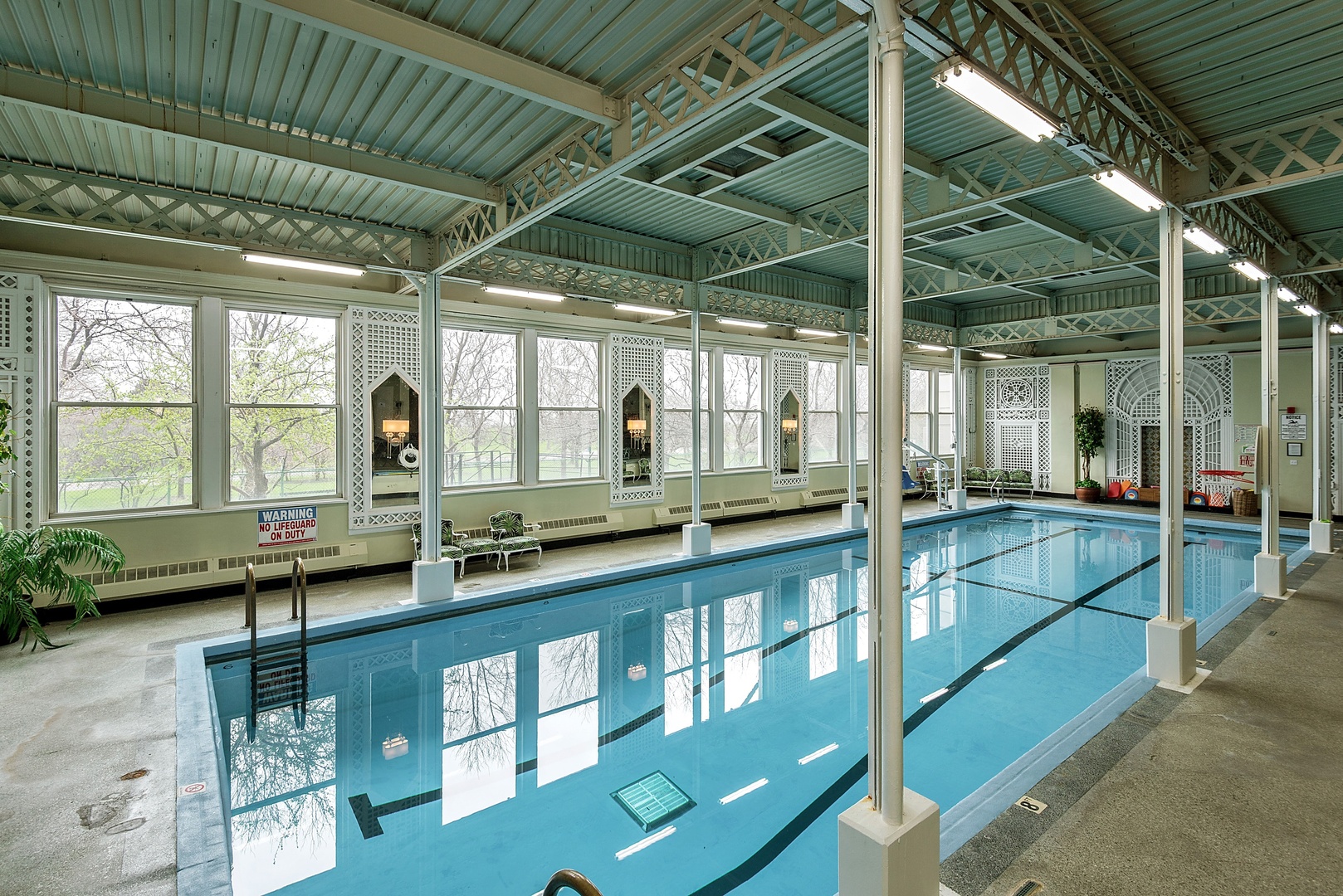 5555 North Sheridan Road, Unit 131 Chicago, IL 60640 - Photo 15 of 24 a view of a swimming pool with a outdoor seating