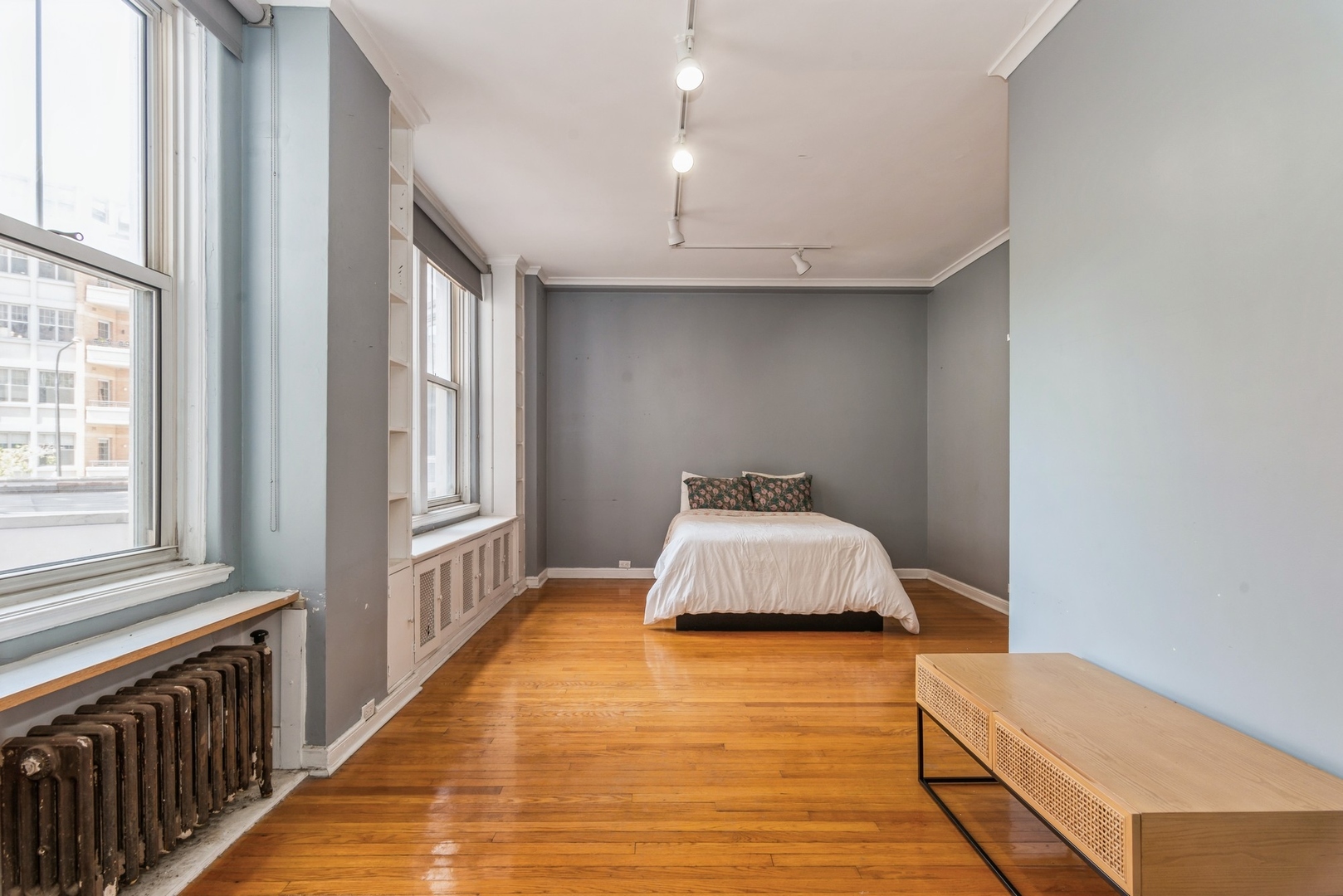 5555 North Sheridan Road, Unit 131 Chicago, IL 60640 - Photo 7 of 24 a bedroom with a bed and a large window