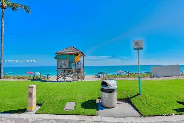 a view of a building with a yard