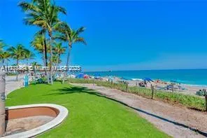 a bedroom with a bed and painting on the wall