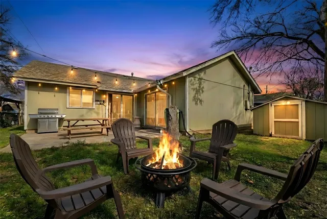 a front view of a house with garden and patio