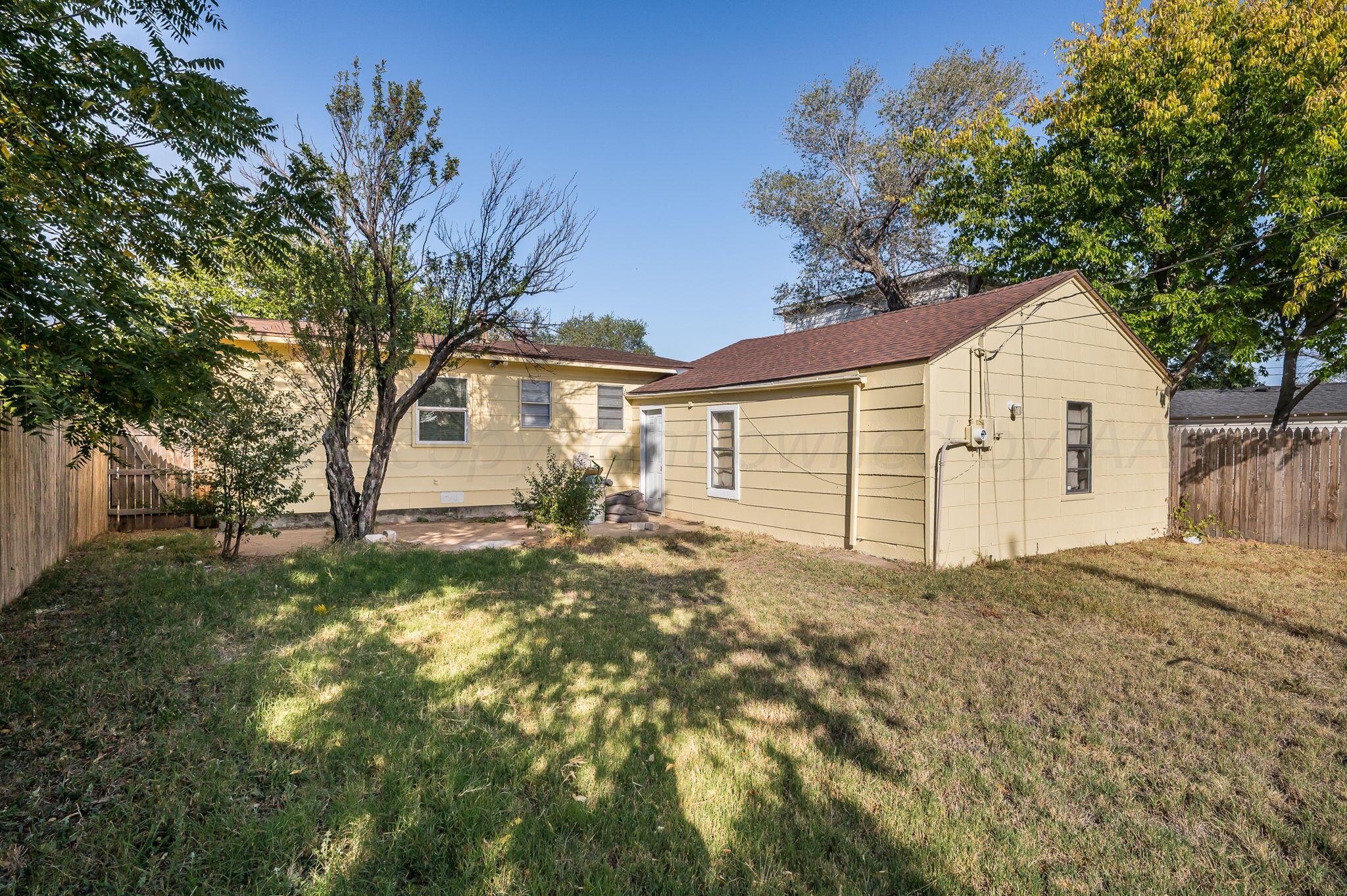 4207 South Ong Street Amarillo, TX 79110 - Photo 16 of 16 a view of a house with a yard