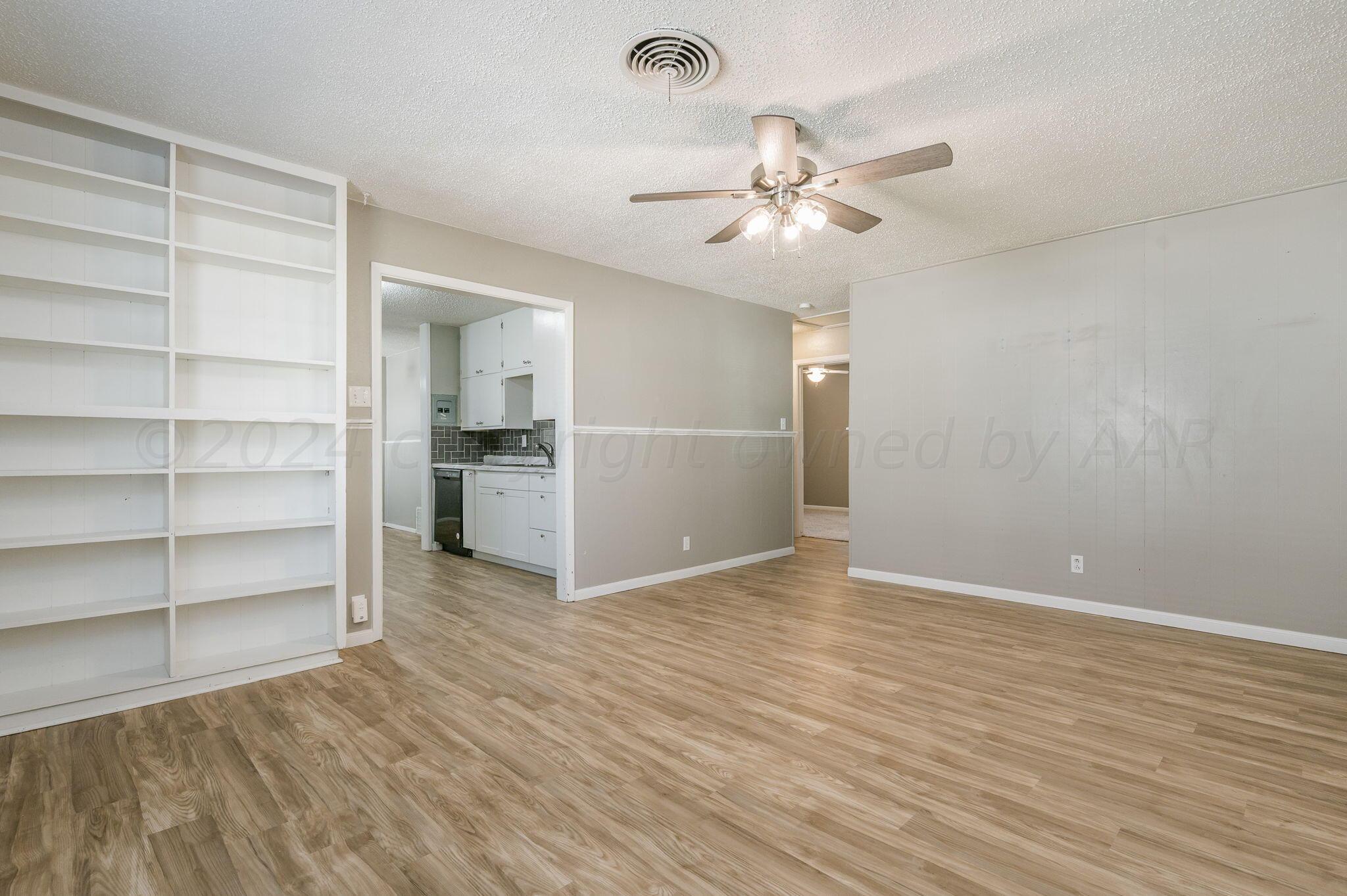 4207 South Ong Street Amarillo, TX 79110 - Photo 3 of 16 a view of an empty room with a window