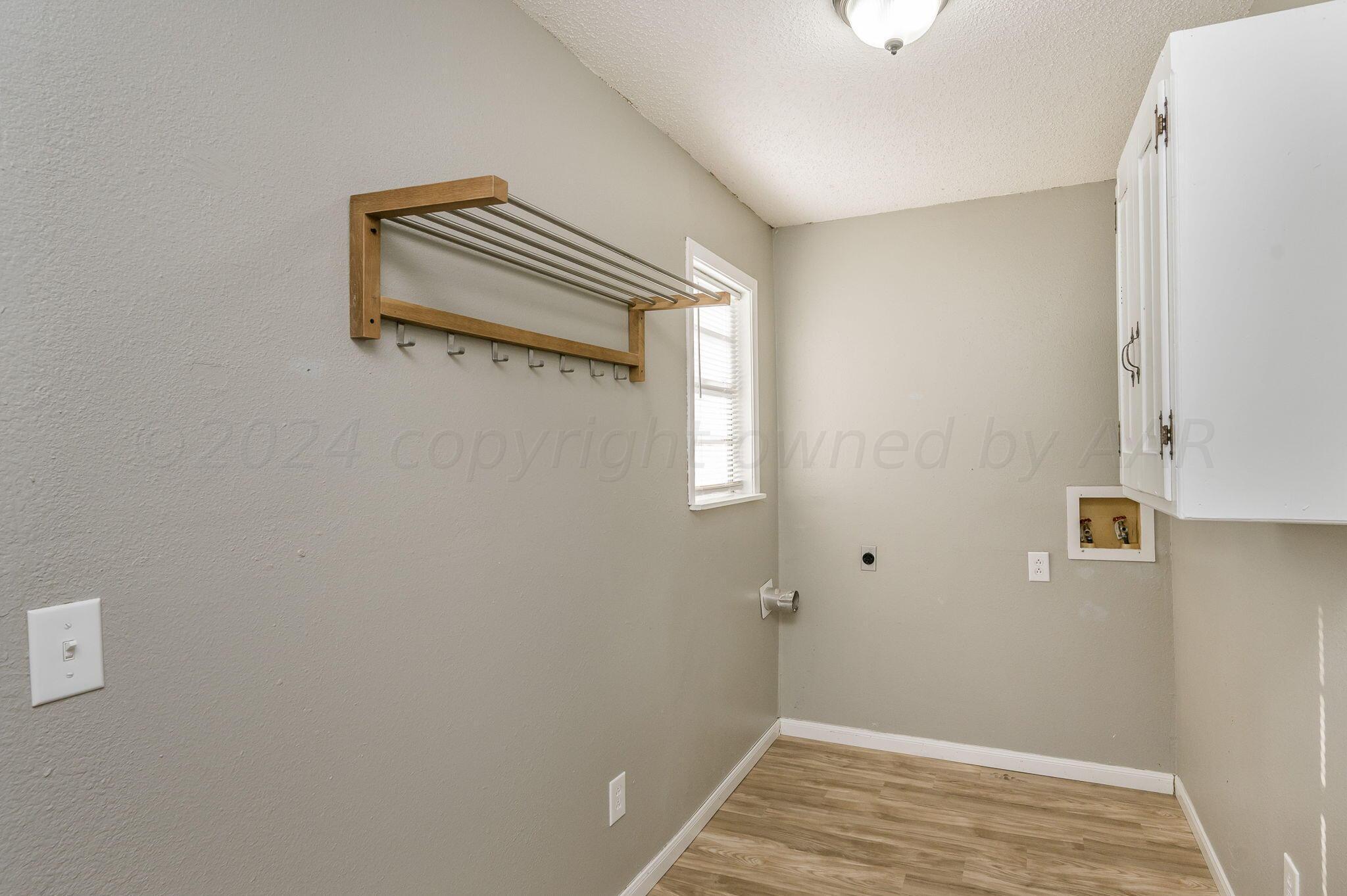 4207 South Ong Street Amarillo, TX 79110 - Photo 9 of 16 a view of space with wooden floor