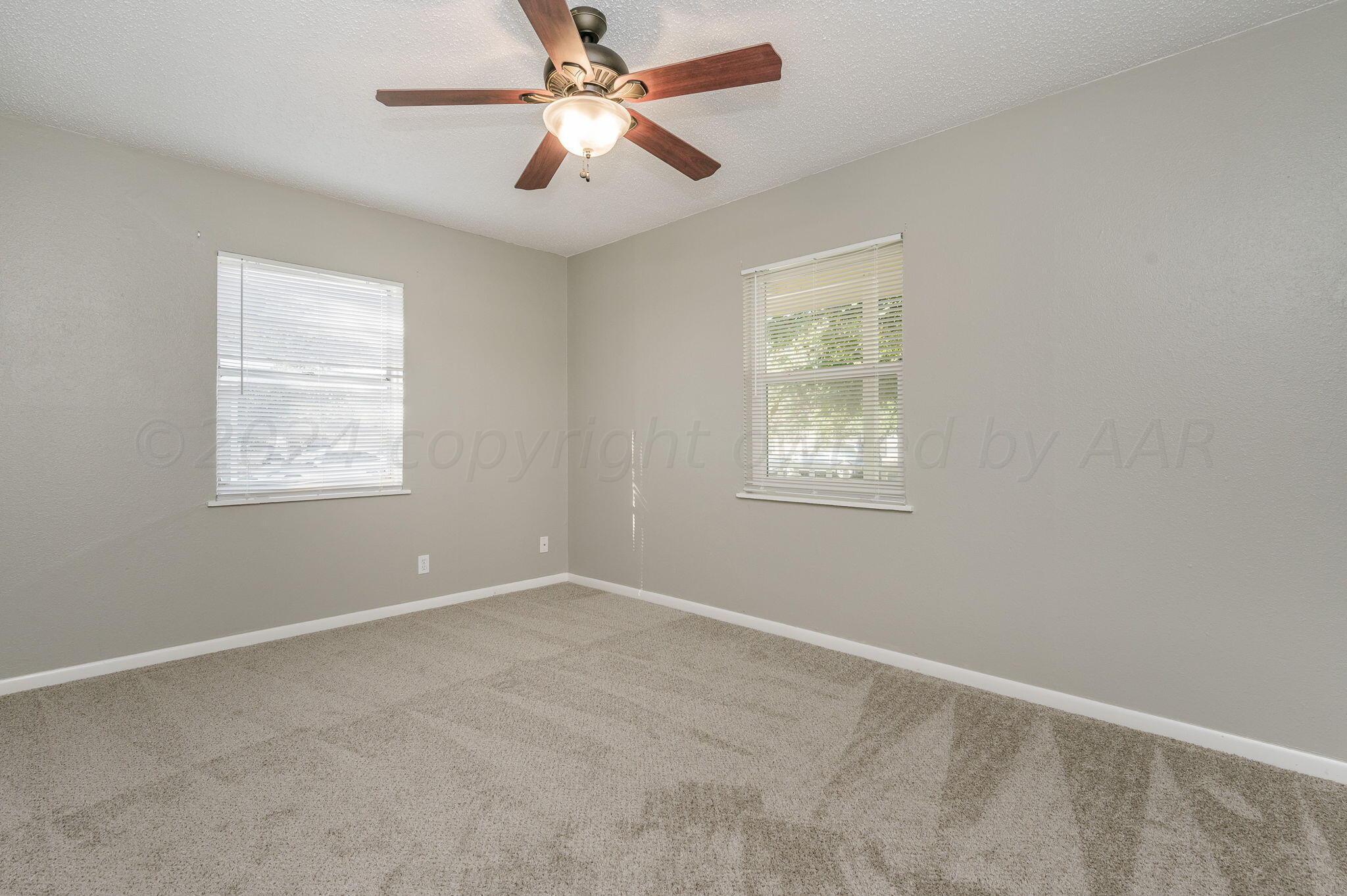 4207 South Ong Street Amarillo, TX 79110 - Photo 10 of 16 a view of an empty room with a window