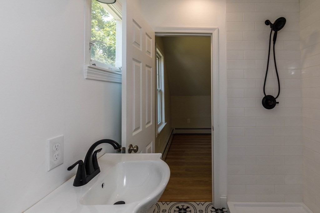 4 Everton Avenue Worcester, MA 01604 - Photo 15 of 26 a bathroom with a sink and a mirror