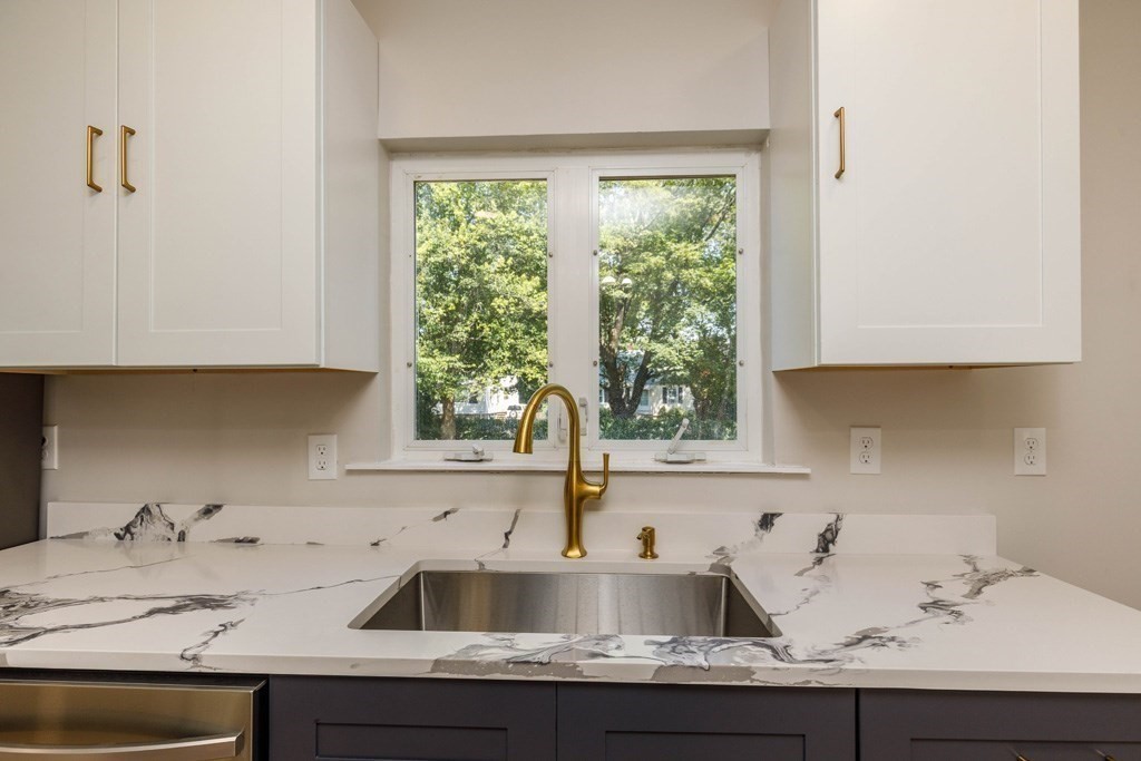 4 Everton Avenue Worcester, MA 01604 - Photo 4 of 26 a kitchen with a sink and a window