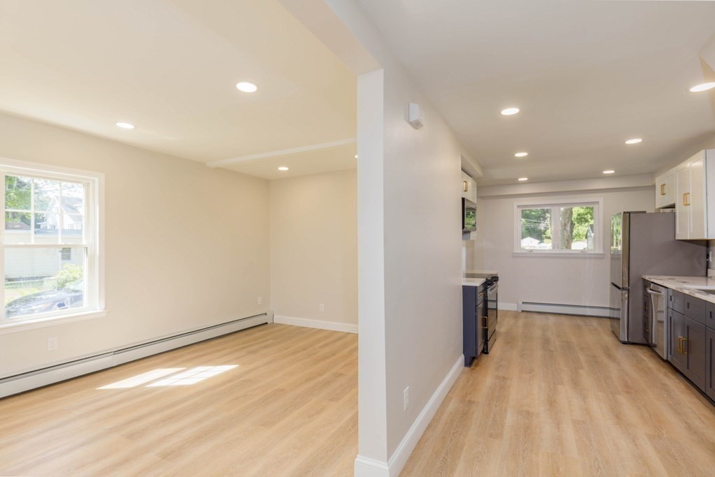 4 Everton Avenue Worcester, MA 01604 - Photo 7 of 26 a view of a kitchen with a sink and a refrigerator