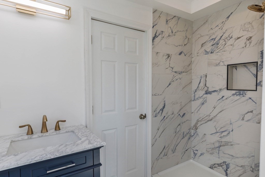4 Everton Avenue Worcester, MA 01604 - Photo 9 of 26 a bathroom with a sink and a mirror