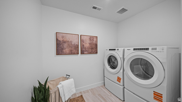 324 North Rhyolite Drive, Unit 87 Hurricane, UT 84737 - Photo 24 of 33 Laundry area with washer and dryer and baseboards