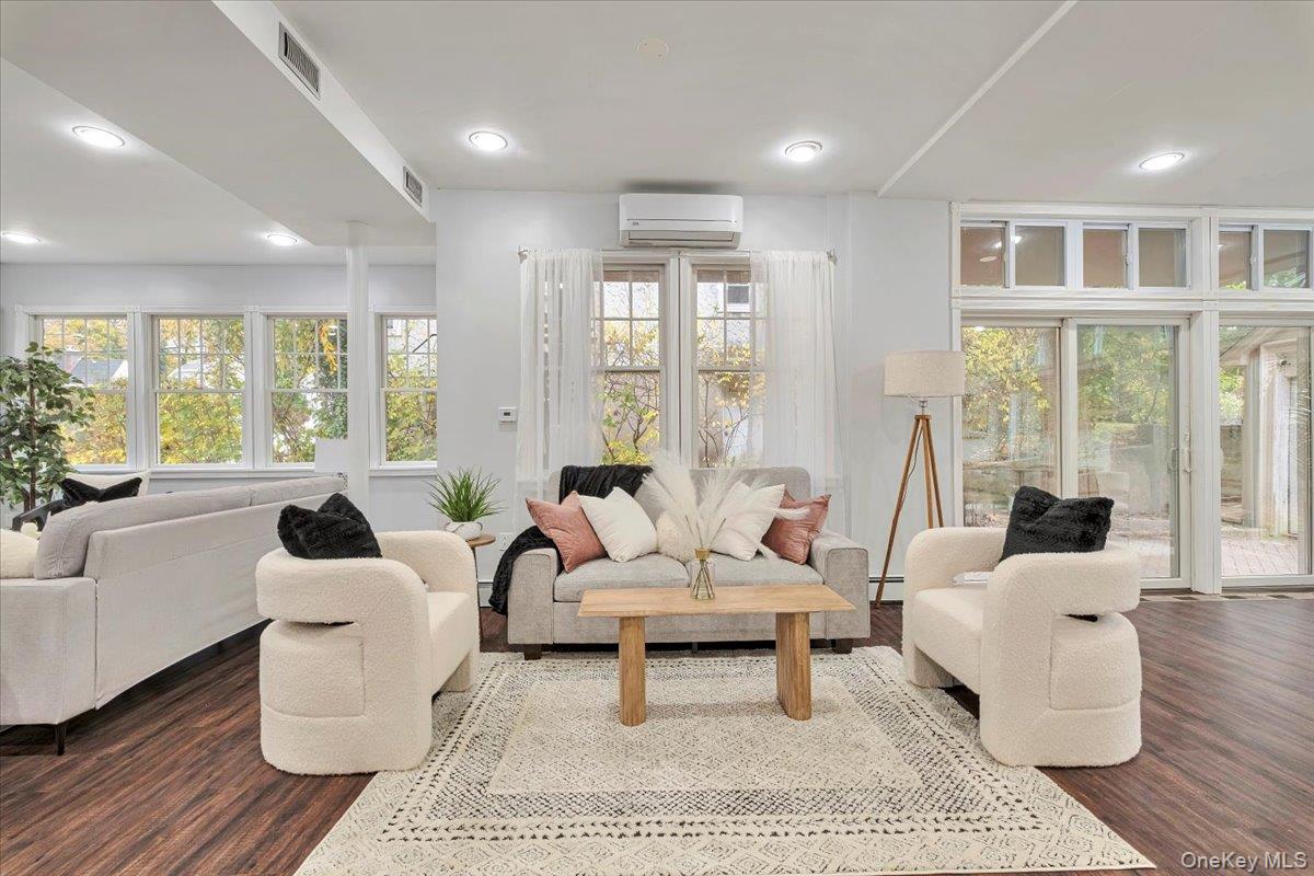 193 Nelson Road Scarsdale, NY 10583 - Photo 7 of 37 a living room with furniture and large windows