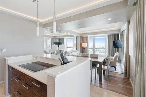 a view of kitchen and dining room with wooden floor