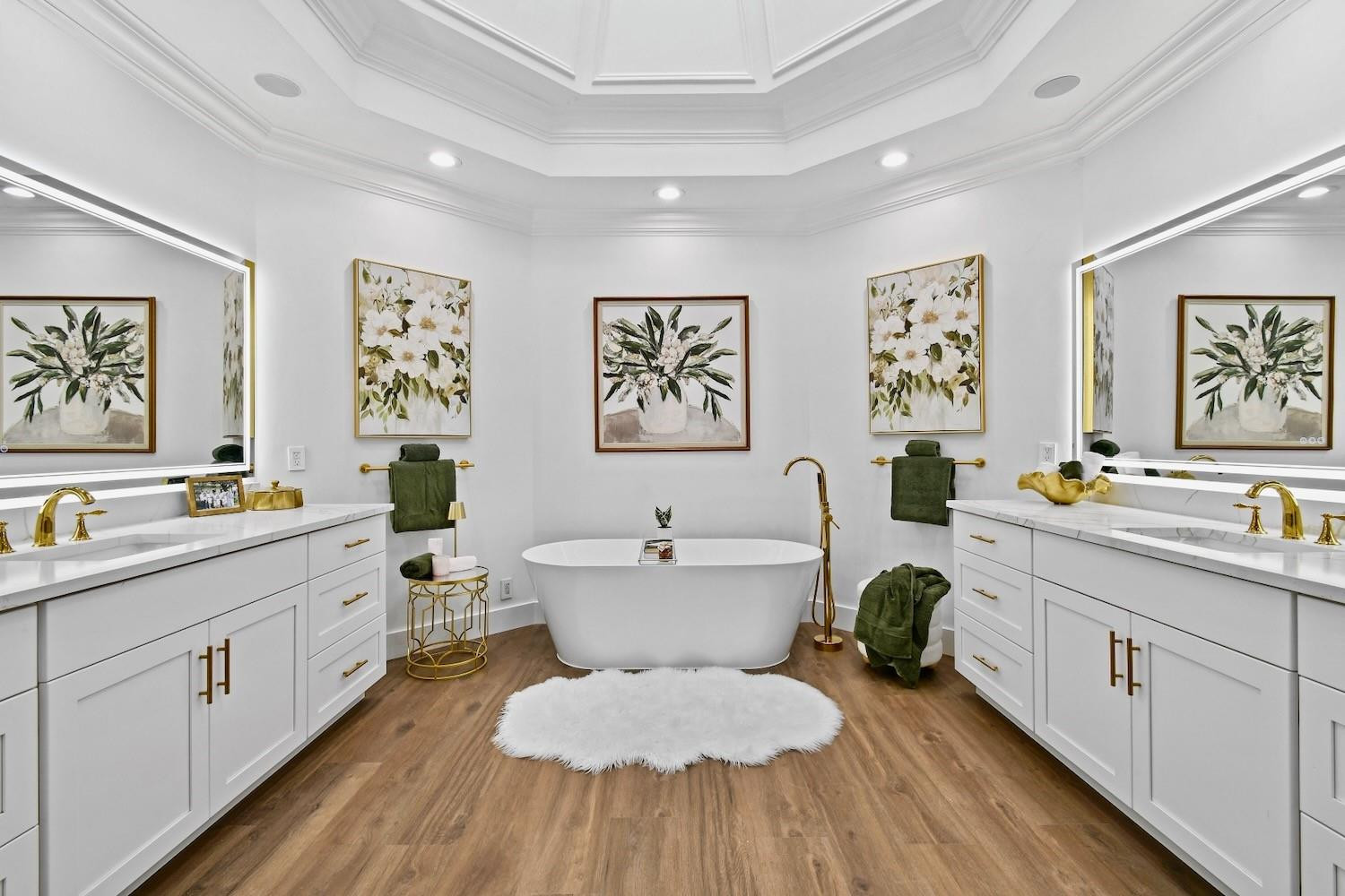 128 Southeast Rio Angelica Port St. Lucie, FL 34984 - Photo 20 of 40 a spacious bathroom with a double vanity sink a mirror a bathtub and a window