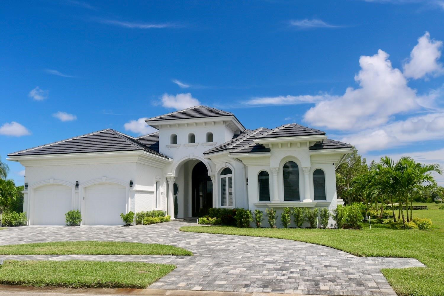 128 Southeast Rio Angelica Port St. Lucie, FL 34984 - Photo 3 of 40 a front view of a house with a yard