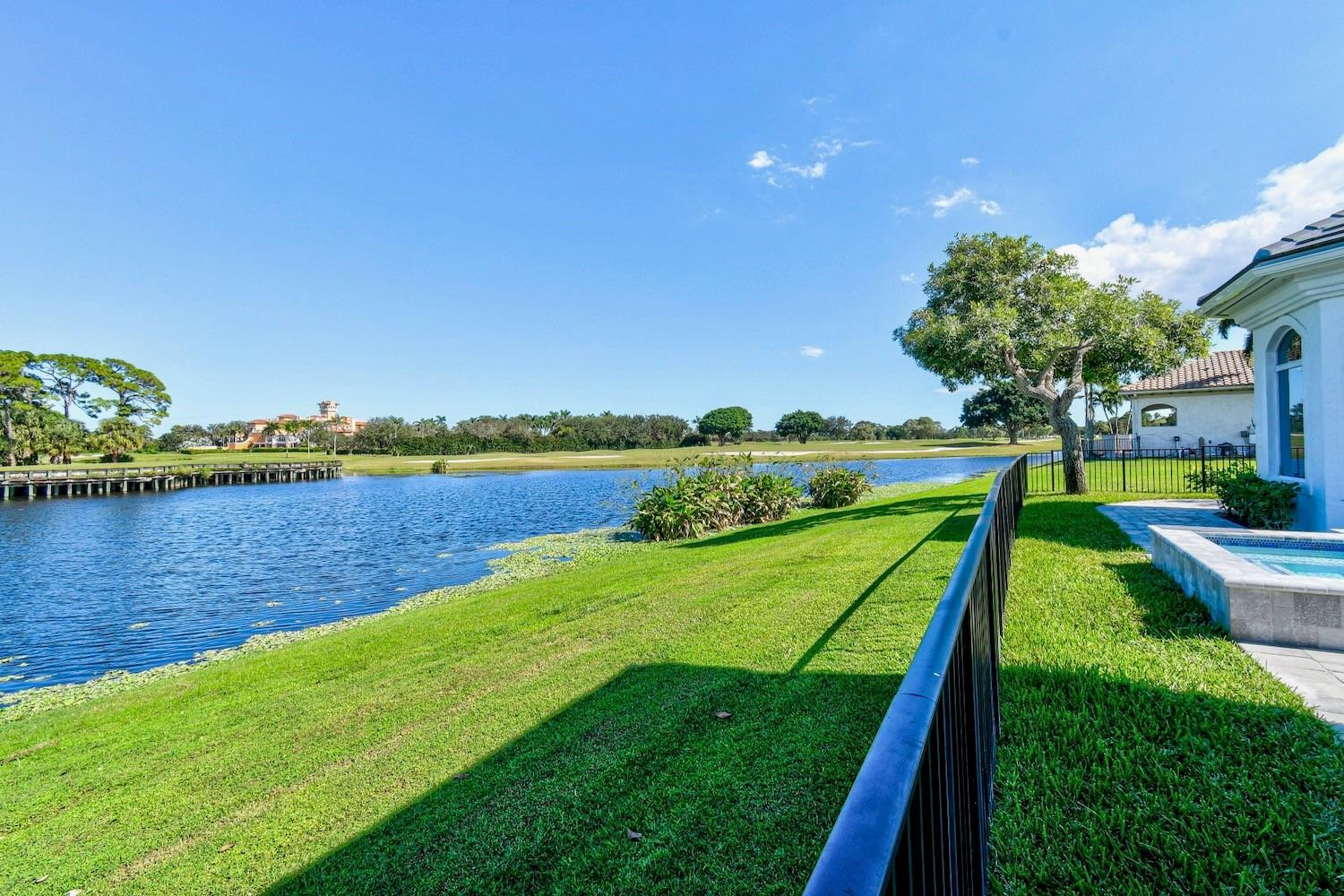 128 Southeast Rio Angelica Port St. Lucie, FL 34984 - Photo 34 of 40 a view of a lake with a big yard