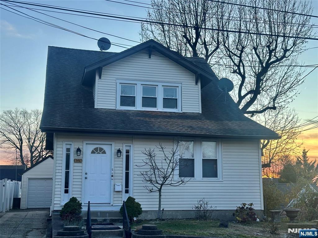 a front view of a house with garage