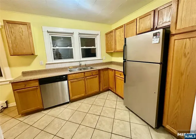 a white refrigerator freezer sitting inside of a kitchen