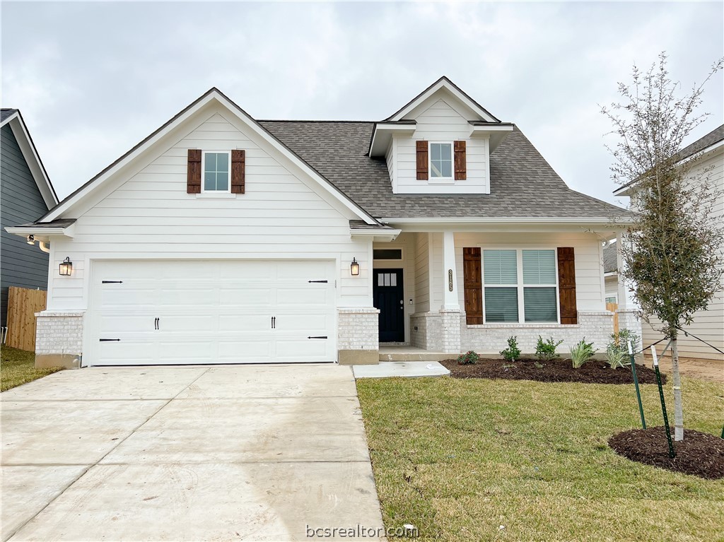 3165 Tarleton Court Bryan, TX 77808 - Photo 1 of 1 a front view of a house with a yard and garage