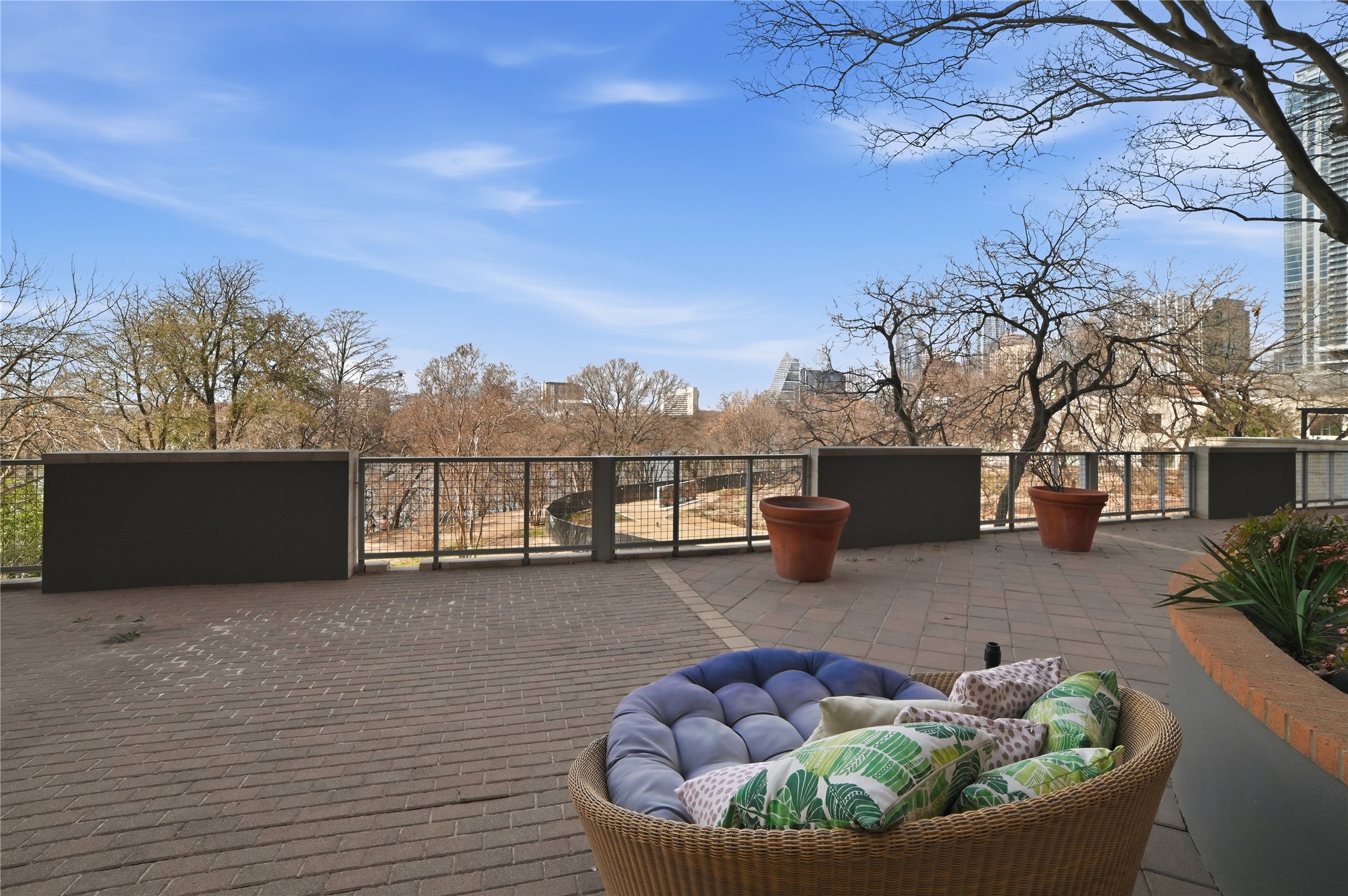 54 Rainey Street, Unit 1018 Austin, TX 78701 - Photo 32 of 32 a view of a terrace with couches and a table