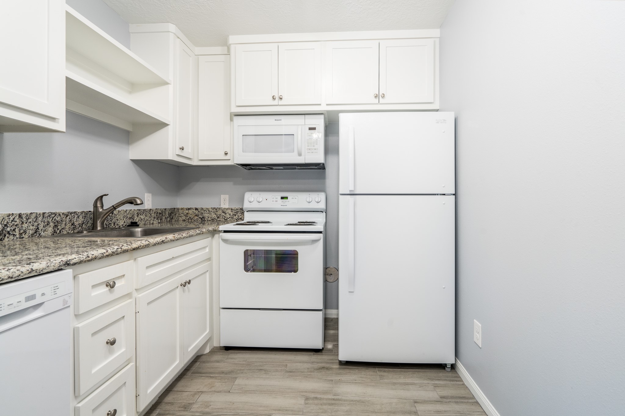 207 North Poplar Street, Unit B Tomball, TX 77375 - Photo 3 of 21 Updated cabinets..wood like tile planks