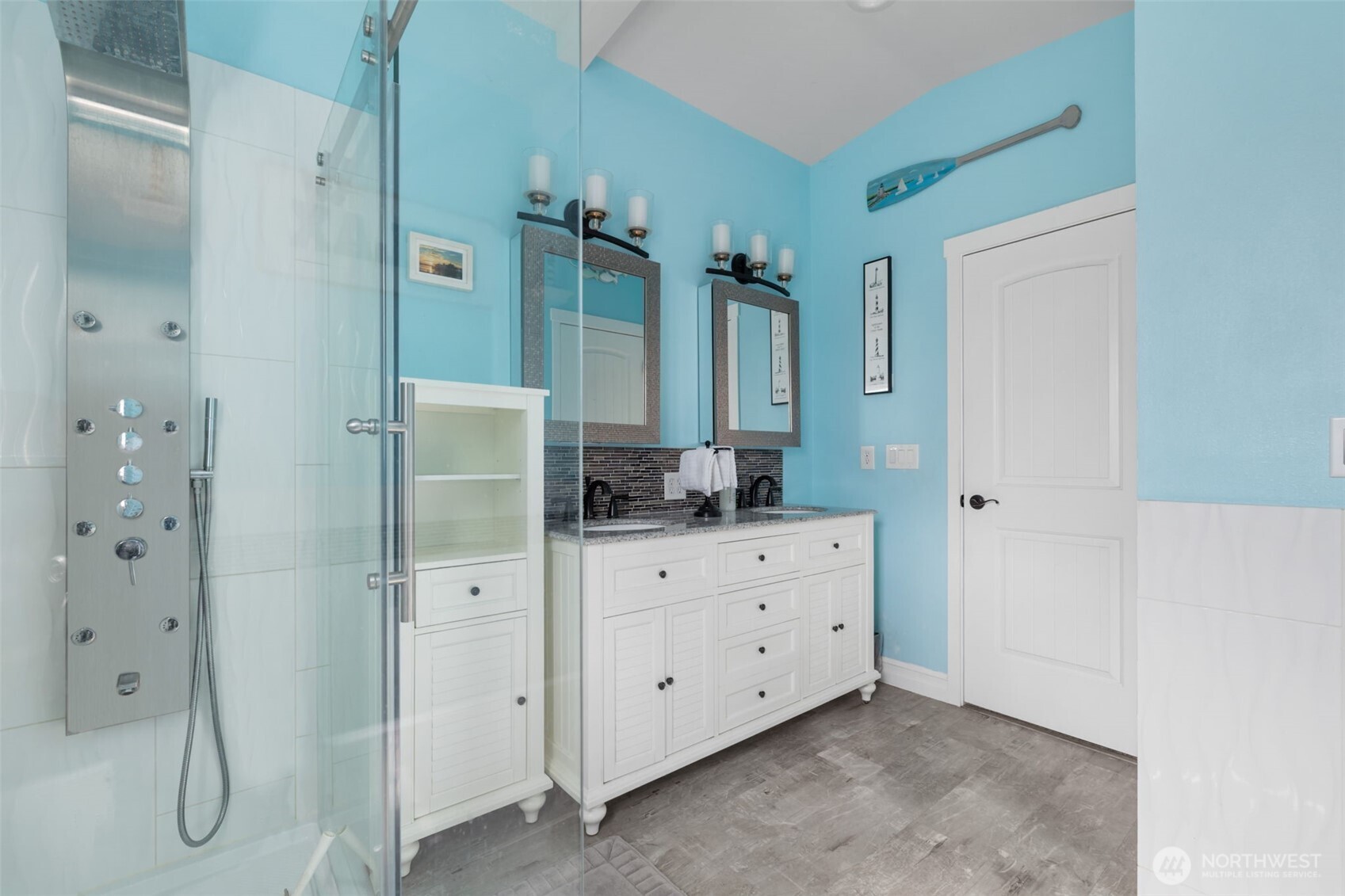 11782 Schold Road Northwest Silverdale, WA 98383 - Photo 12 of 40 a bathroom with a shower sink and mirror