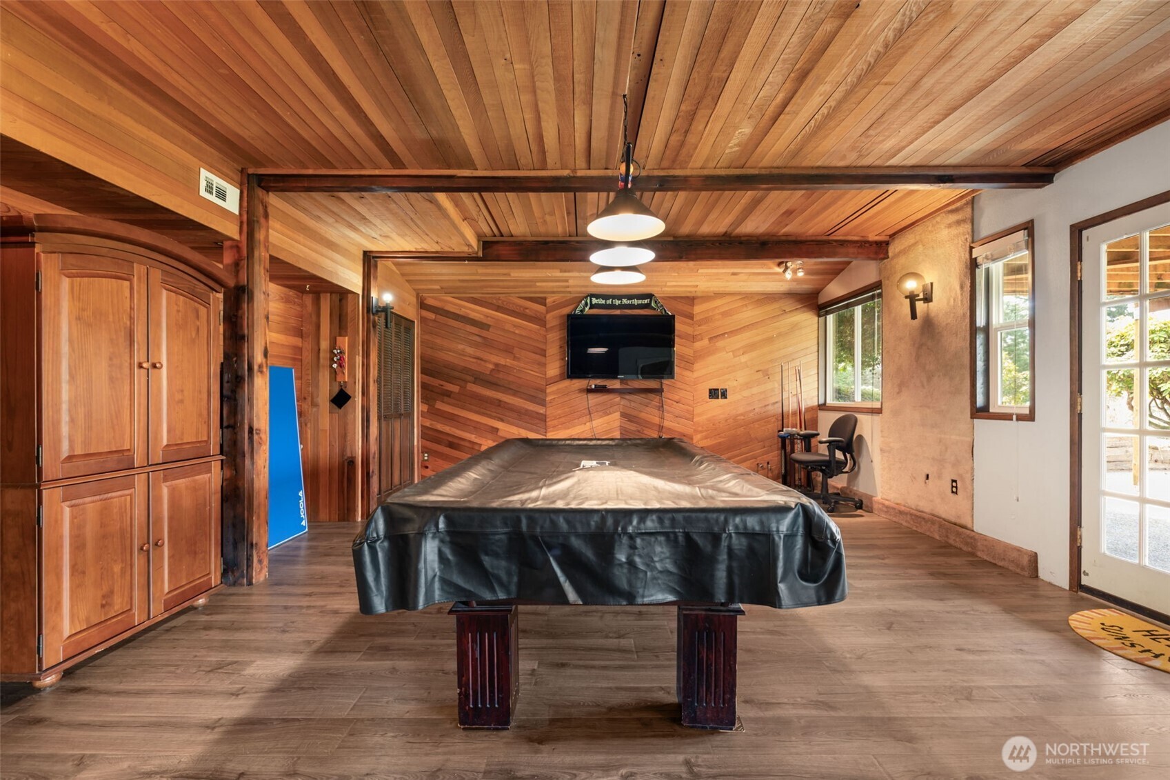 11782 Schold Road Northwest Silverdale, WA 98383 - Photo 20 of 40 a bed room with a bed and a chandelier